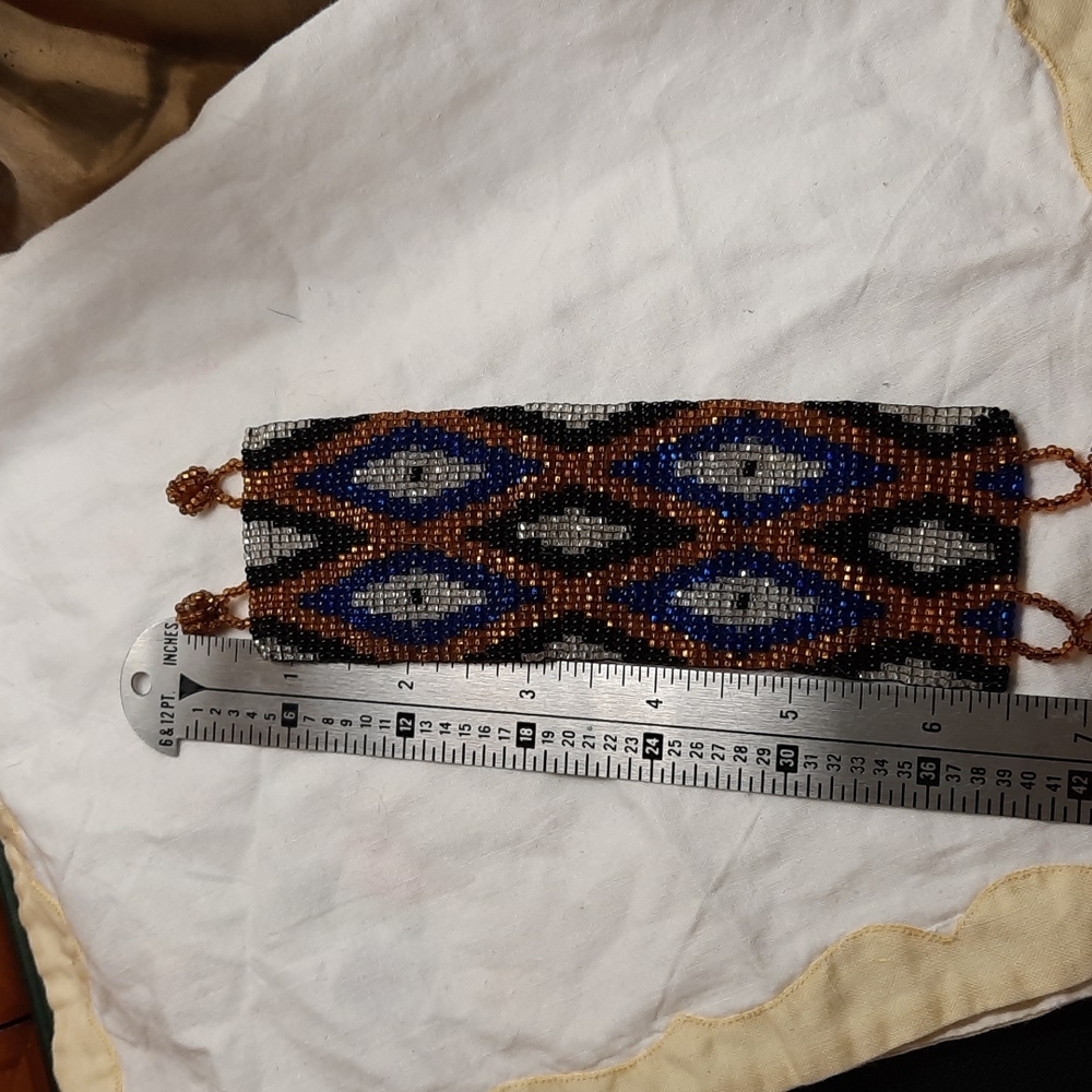 Beautiful thick beaded bracelet black gold blue clear wide